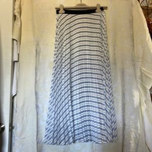 Maje long plated skirt. Elastic on the waist. New with no tag